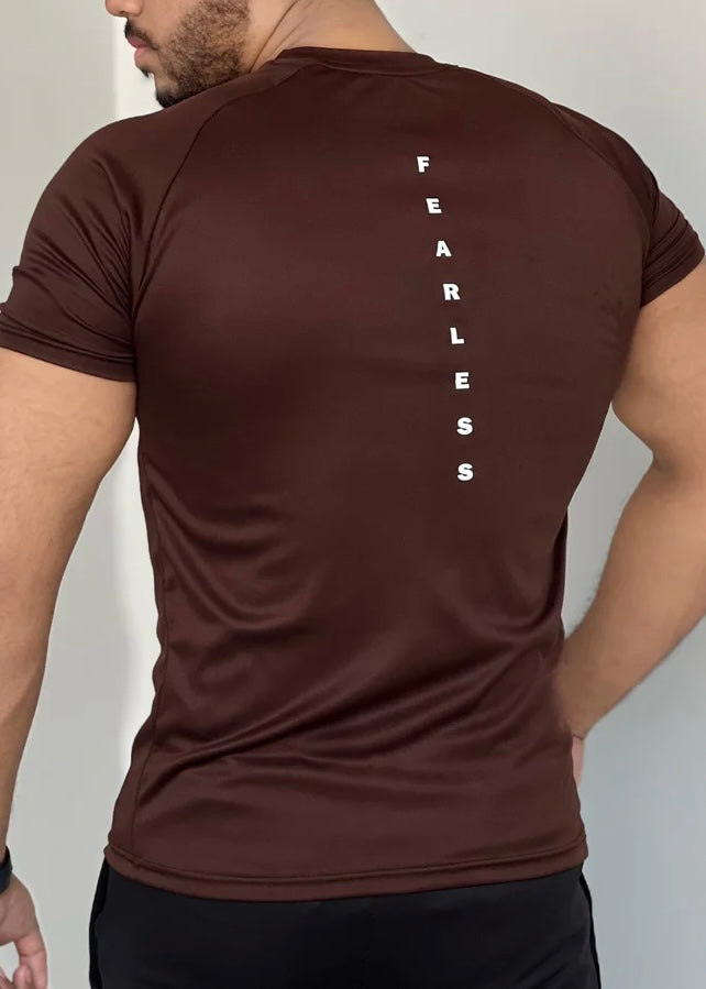 BROWN DOMINATE YOUR WORKOUTS WITH LYCRA'S SHIRT'S SEAMLESS DESIGN